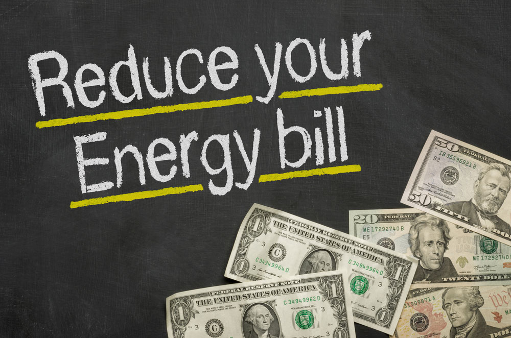 chalk writing of reduce your energy bill with dollar bills in right bottom corner